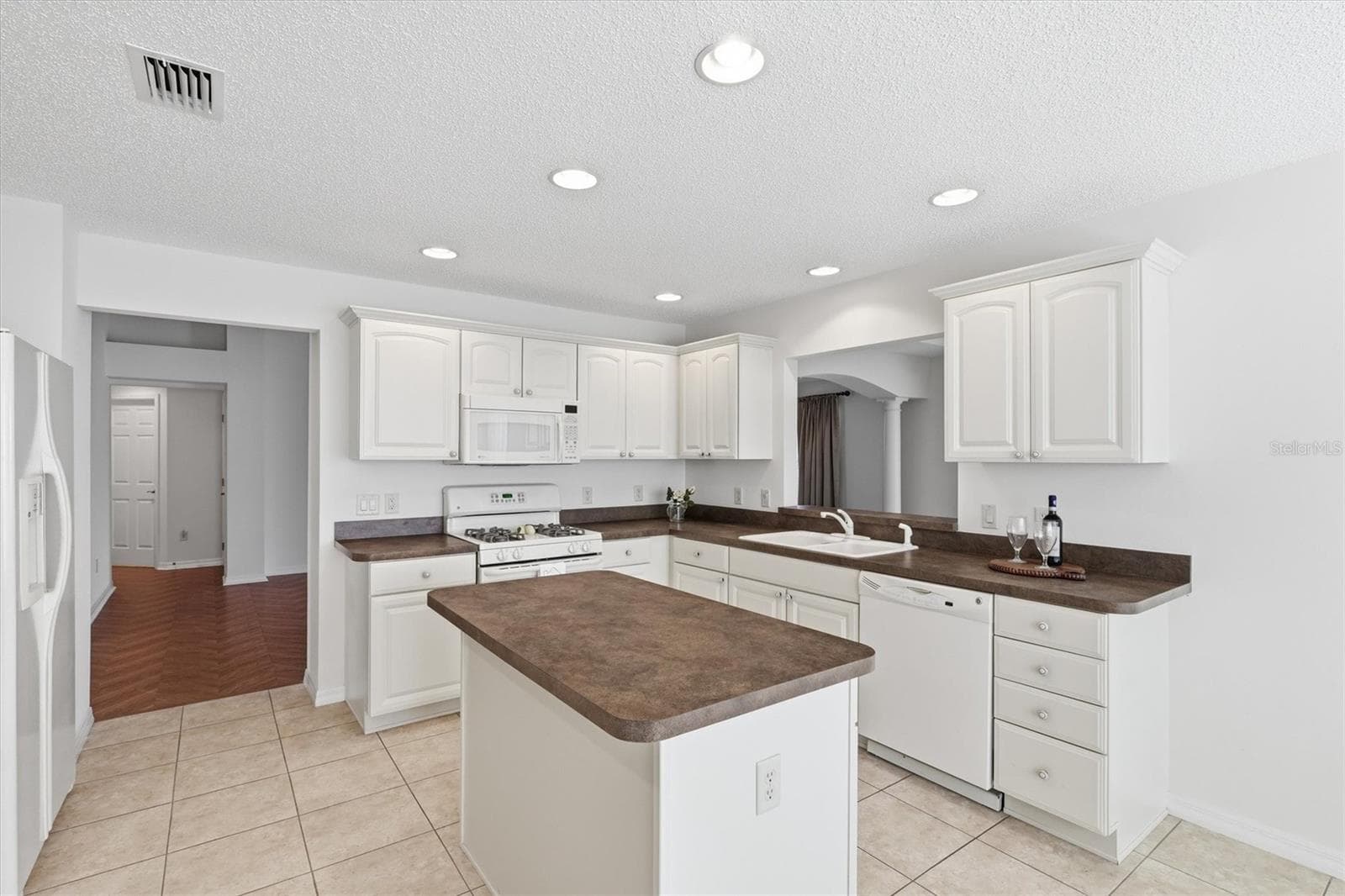 Large Kitchen with Lots of Cabinet and Prep Space, Tile floors. - 1563 EASTOVER TER, THE VILLAGES