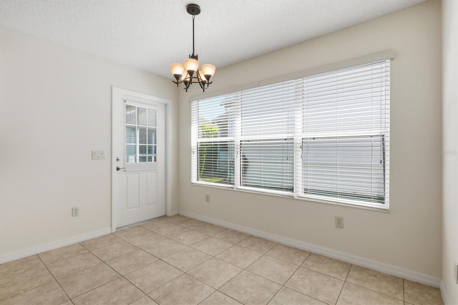 Dinette leads outside to Screened in Lanai. - 1563 EASTOVER TER, THE VILLAGES
