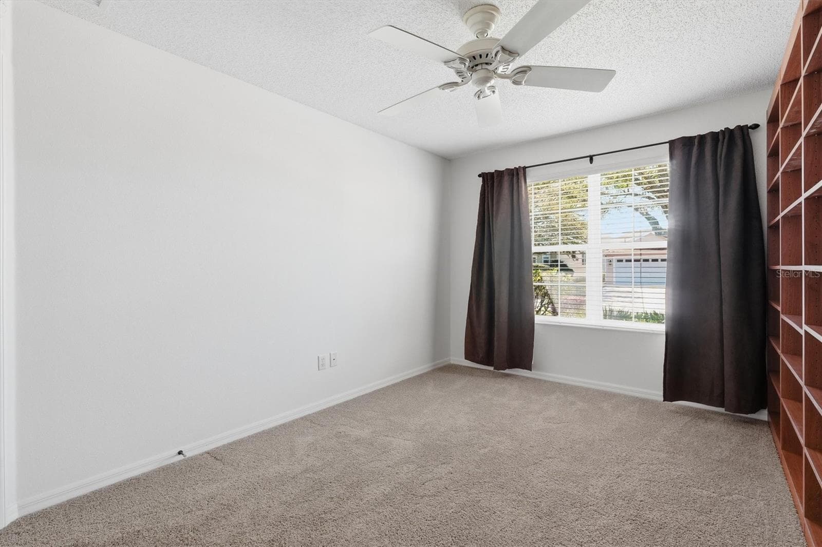 Bedroom #2 used as a Office or 2nd bedroom. Carpet and Ceiling Fan. - 1563 EASTOVER TER, THE VILLAGES