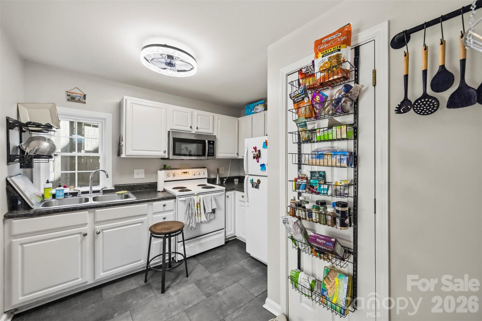 Unit B kitchen (9'10" x 11'8") on the main level. - 220 Armour Street, Davidson