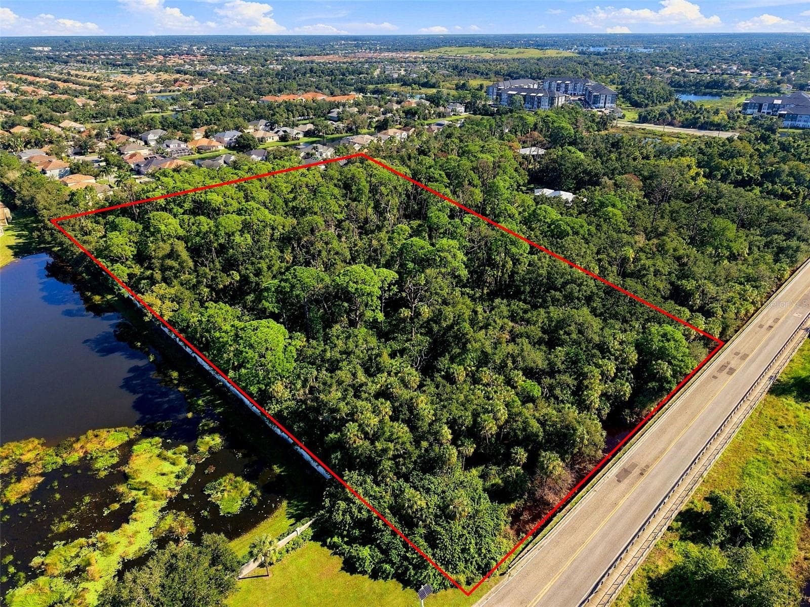 View from SW corner of parcel. South boundary abuts Whitfield Ave. - 68TH AVE E, SARASOTA