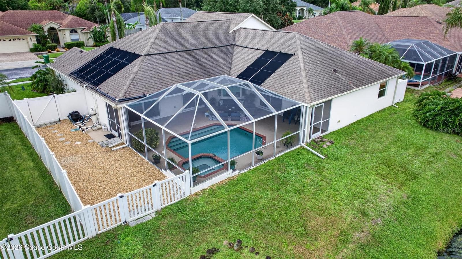 Screened pool, spa, and fenced yard - 3726 SUNWARD DR, MERRITT ISLAND