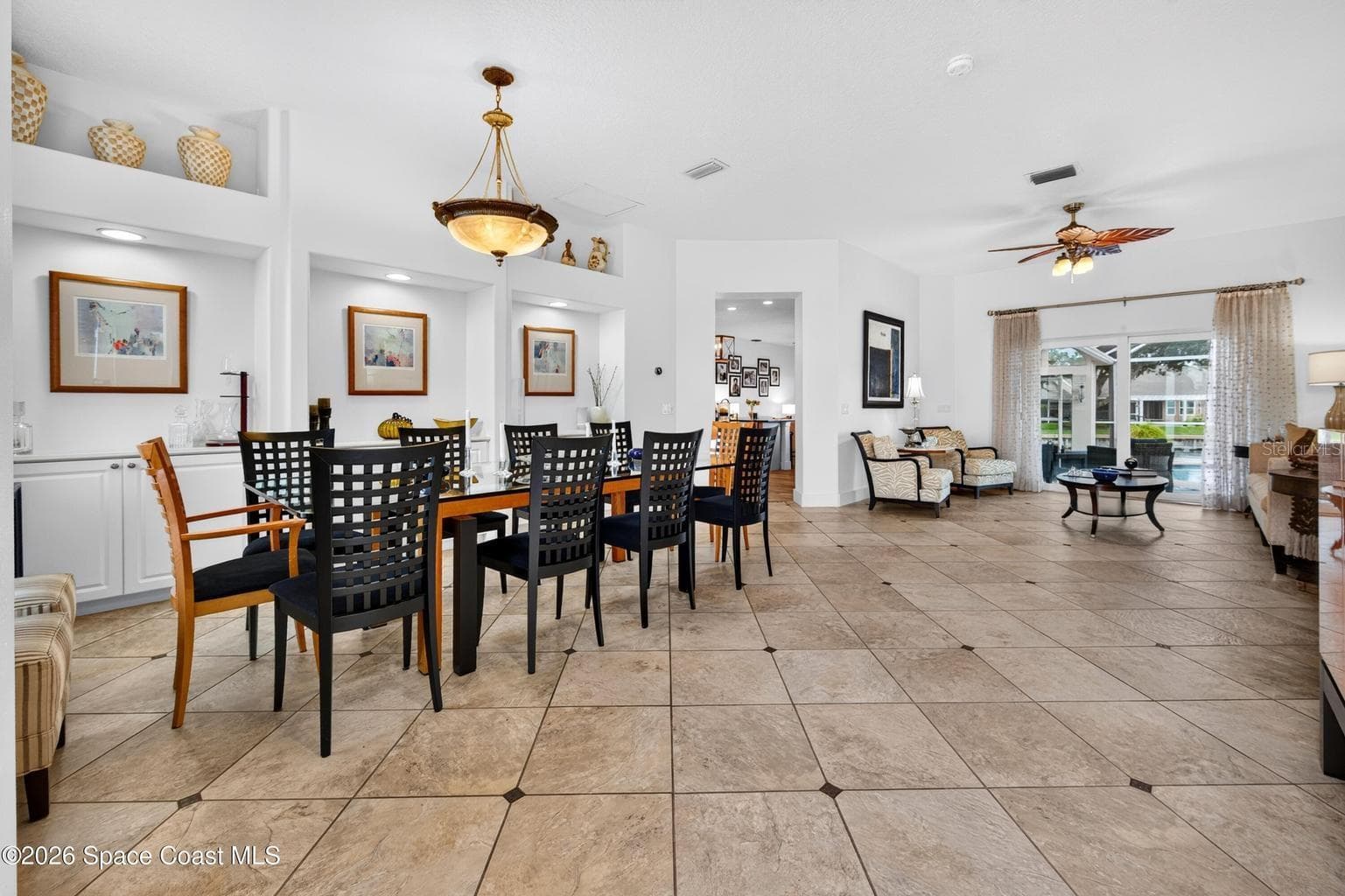 Open dining flows to living and lanai - 3726 SUNWARD DR, MERRITT ISLAND