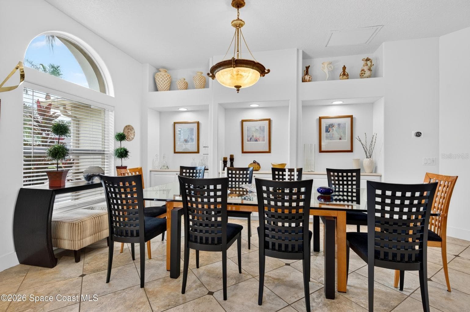 Formal dining with arched window - 3726 SUNWARD DR, MERRITT ISLAND