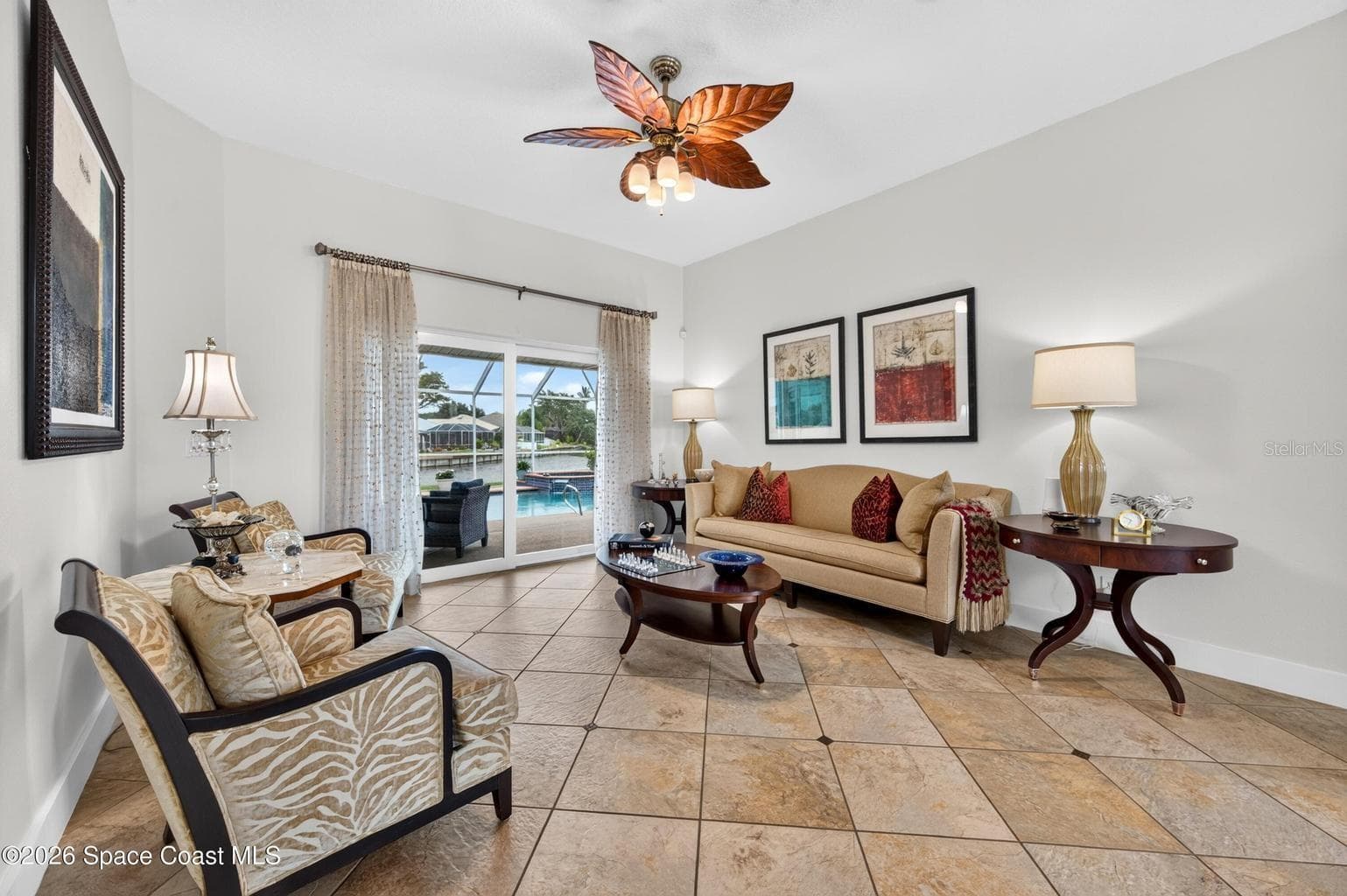 Bright living room with pool views - 3726 SUNWARD DR, MERRITT ISLAND
