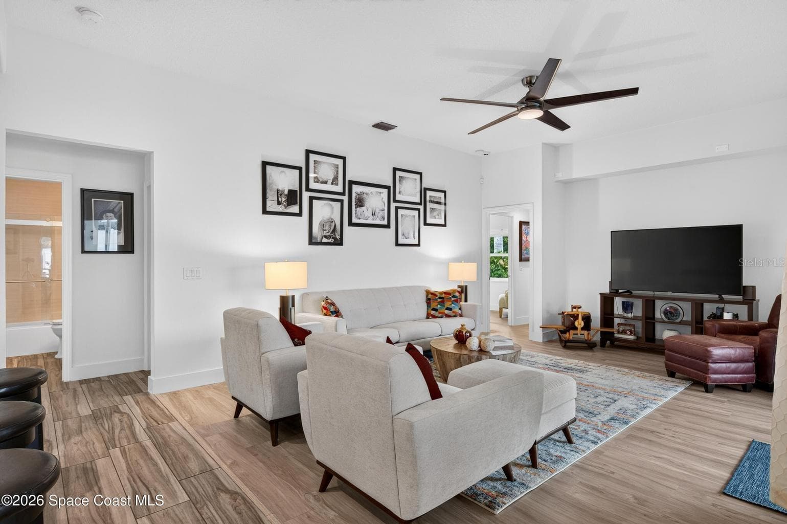 Spacious family room, wood look floors - 3726 SUNWARD DR, MERRITT ISLAND