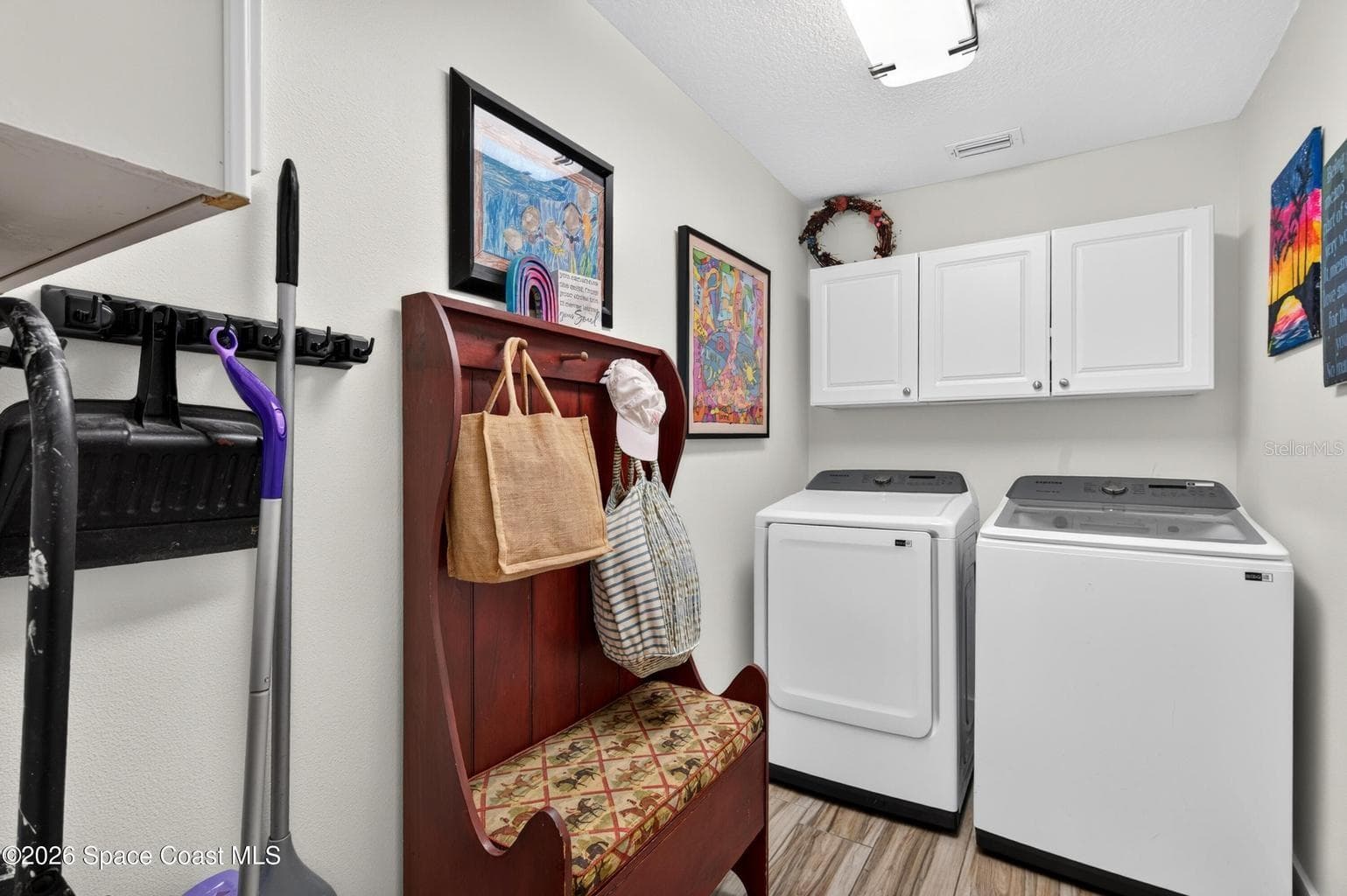 Laundry room with cabinet storage - 3726 SUNWARD DR, MERRITT ISLAND