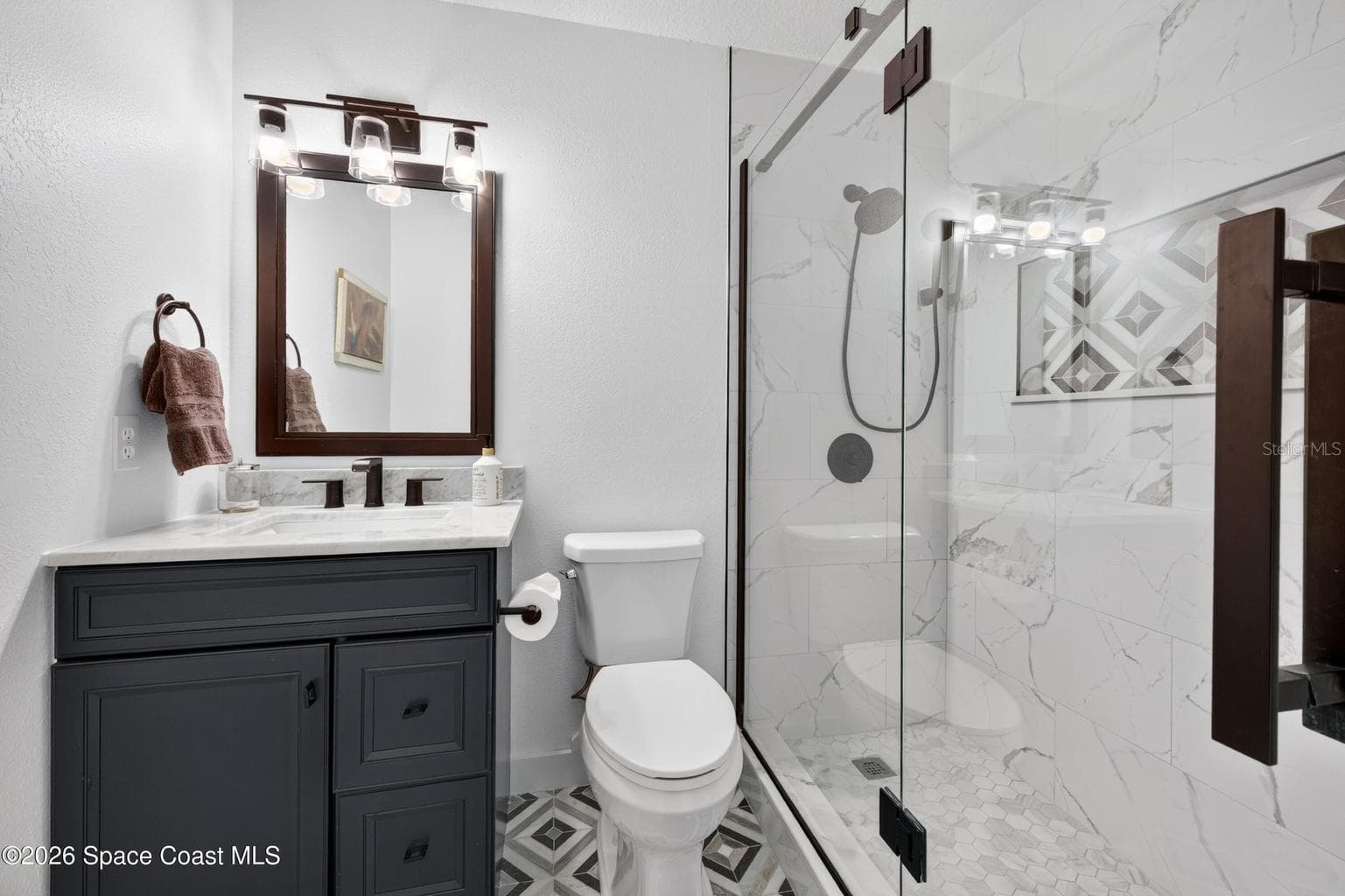 Updated bath with frameless shower - 3726 SUNWARD DR, MERRITT ISLAND