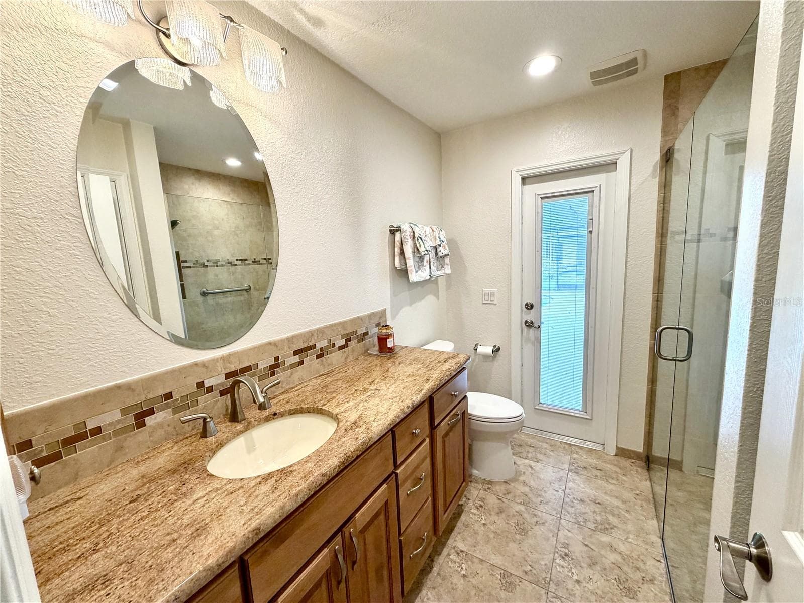 Guest Bathroom looking toward the pool door - 23411 MULLINS AVE, PORT CHARLOTTE