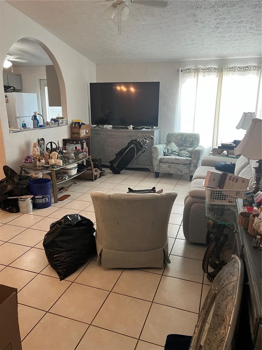 View of messy "estate sale" - 4715 STONEPOINTE PL, TAMPA