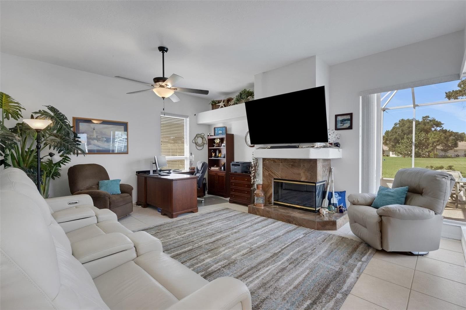 Family room with view of golf course and pool - 4806 PERIDIA BLVD E, BRADENTON