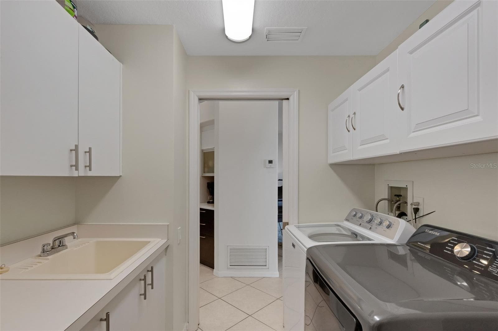 Laundry room with sink and countertop - 4806 PERIDIA BLVD E, BRADENTON