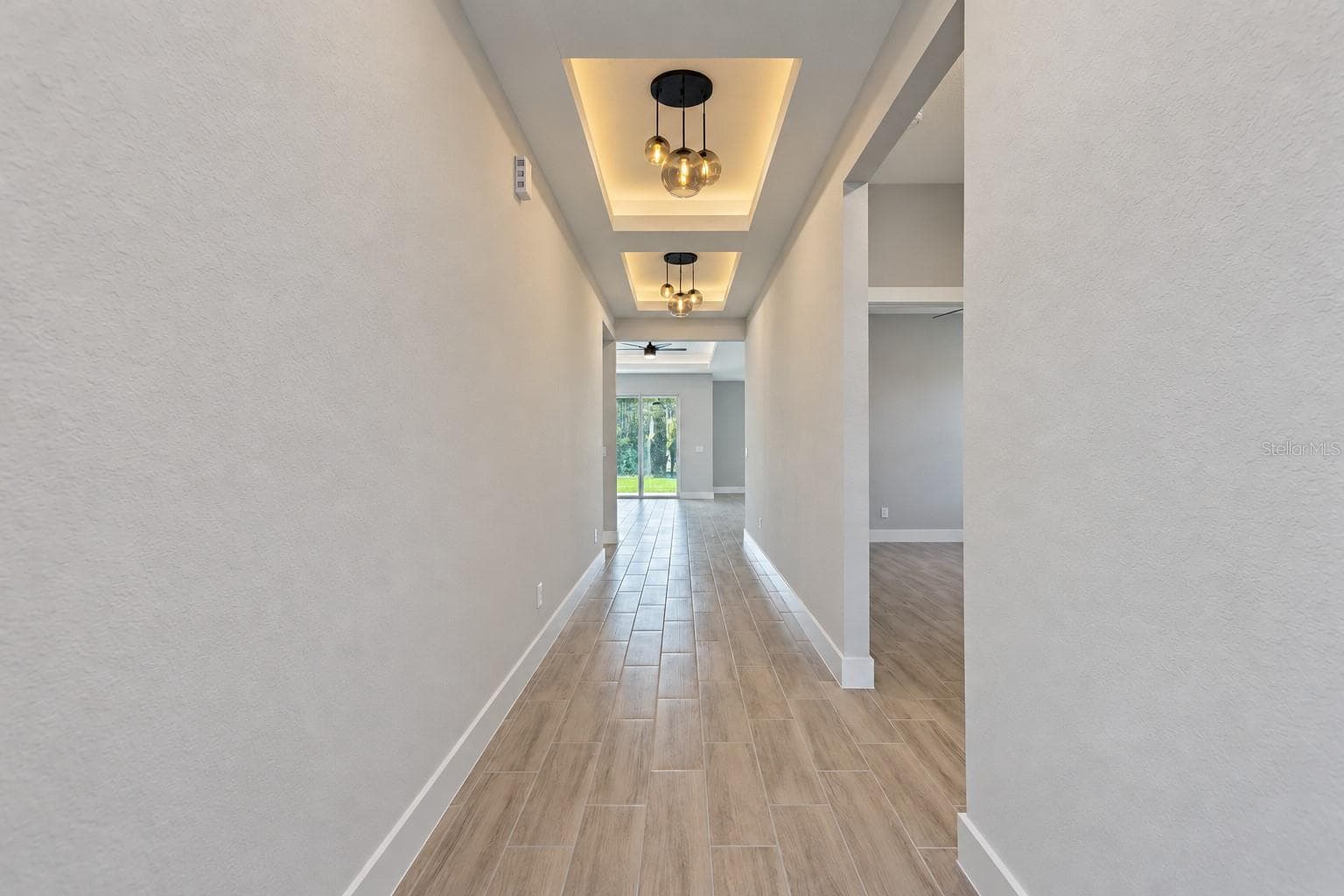 Entry hallway. Digitally edited model/property composite. - 24479 SW KINGSWAY CIR, ARCADIA