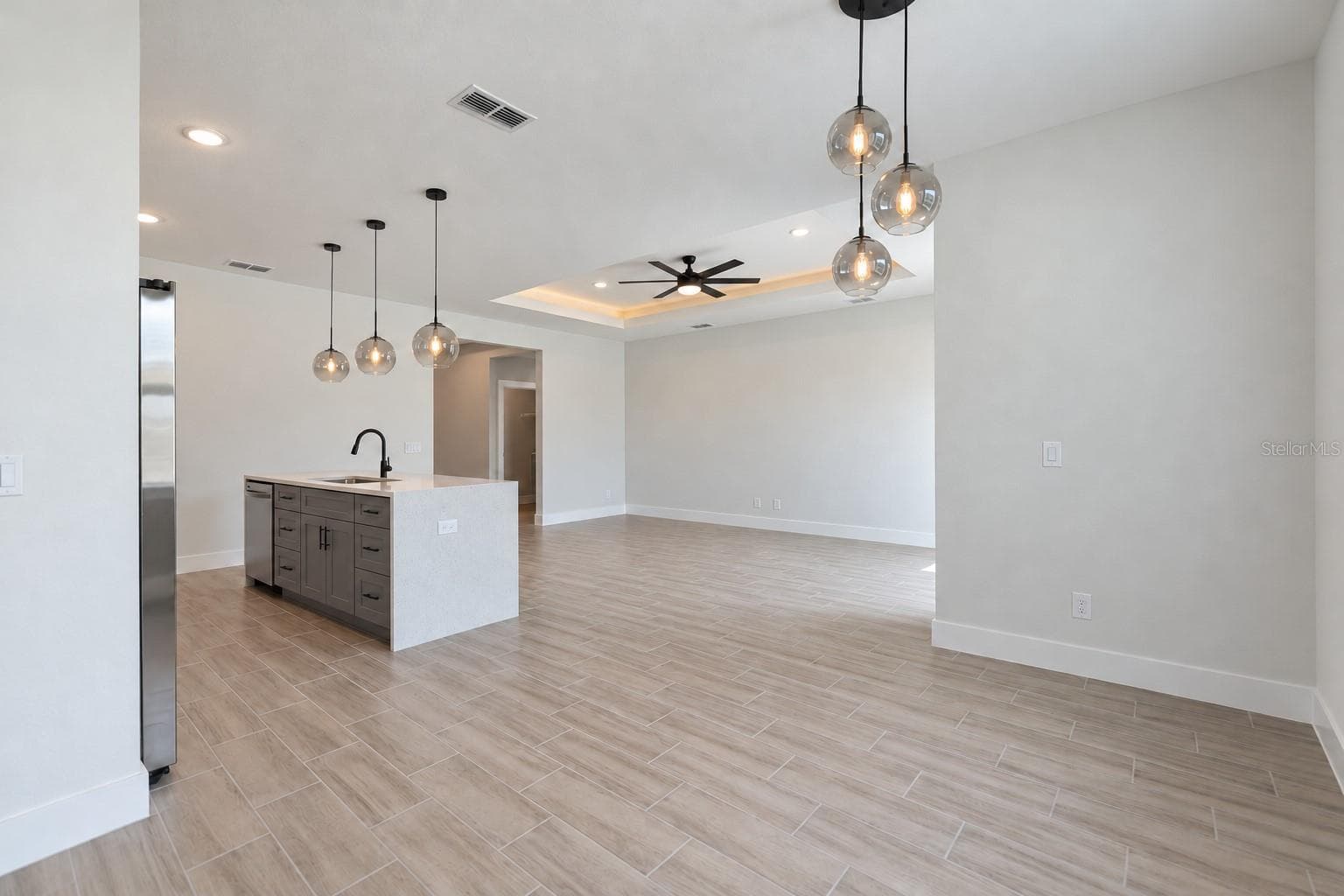 Dining toward living. Digitally edited model/property composite. - 24479 SW KINGSWAY CIR, ARCADIA