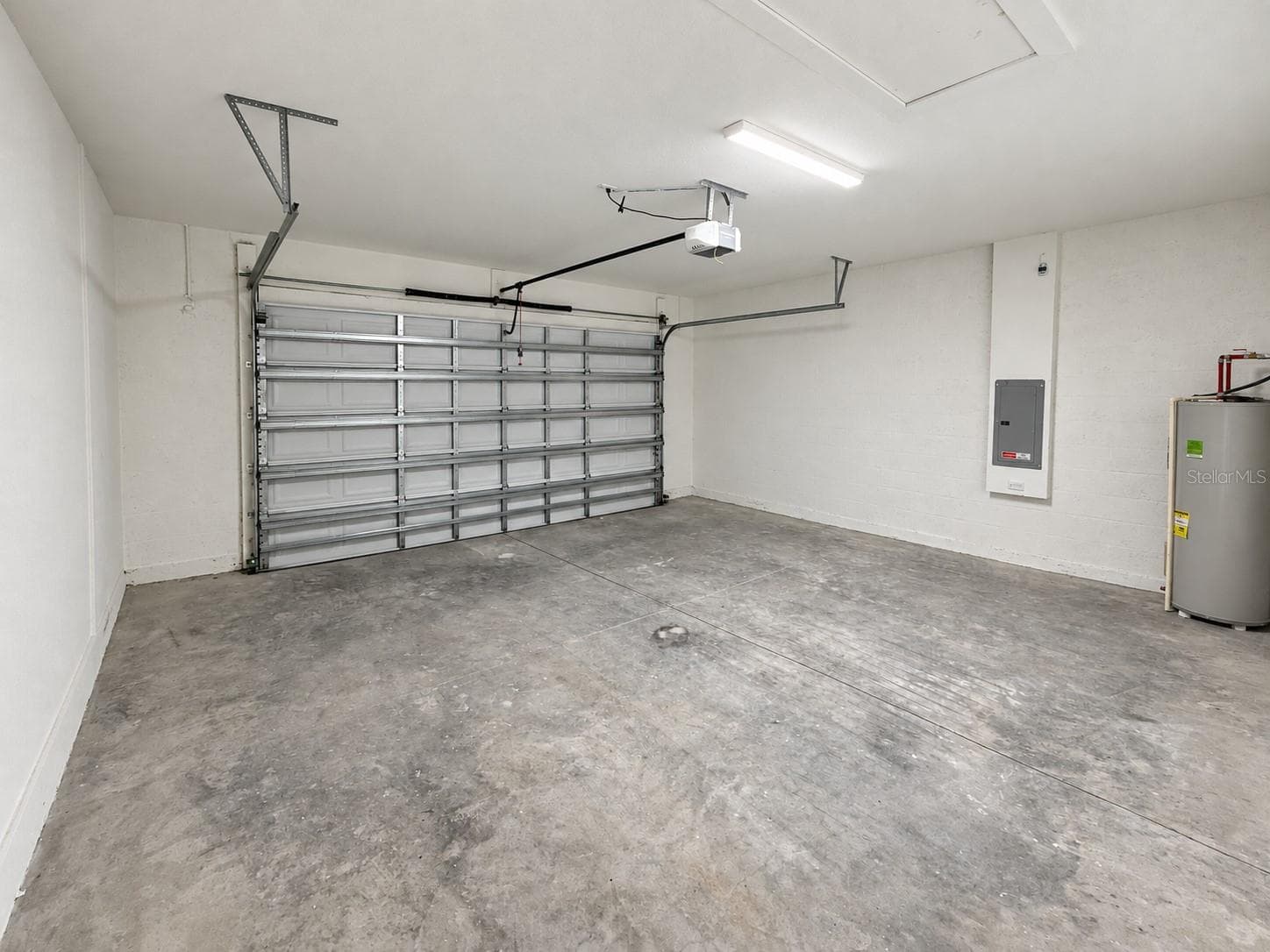 Garage. Actual property photo, digitally refined. - 24479 SW KINGSWAY CIR, ARCADIA