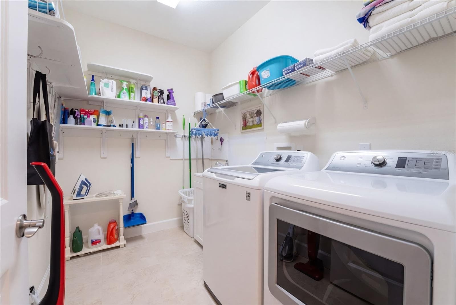 9' x 6'6" Utility Room w/ laundry tub, washer, natural gas dryer & storage shelves - 1233 EGGLESTON DRIVE, DELAND