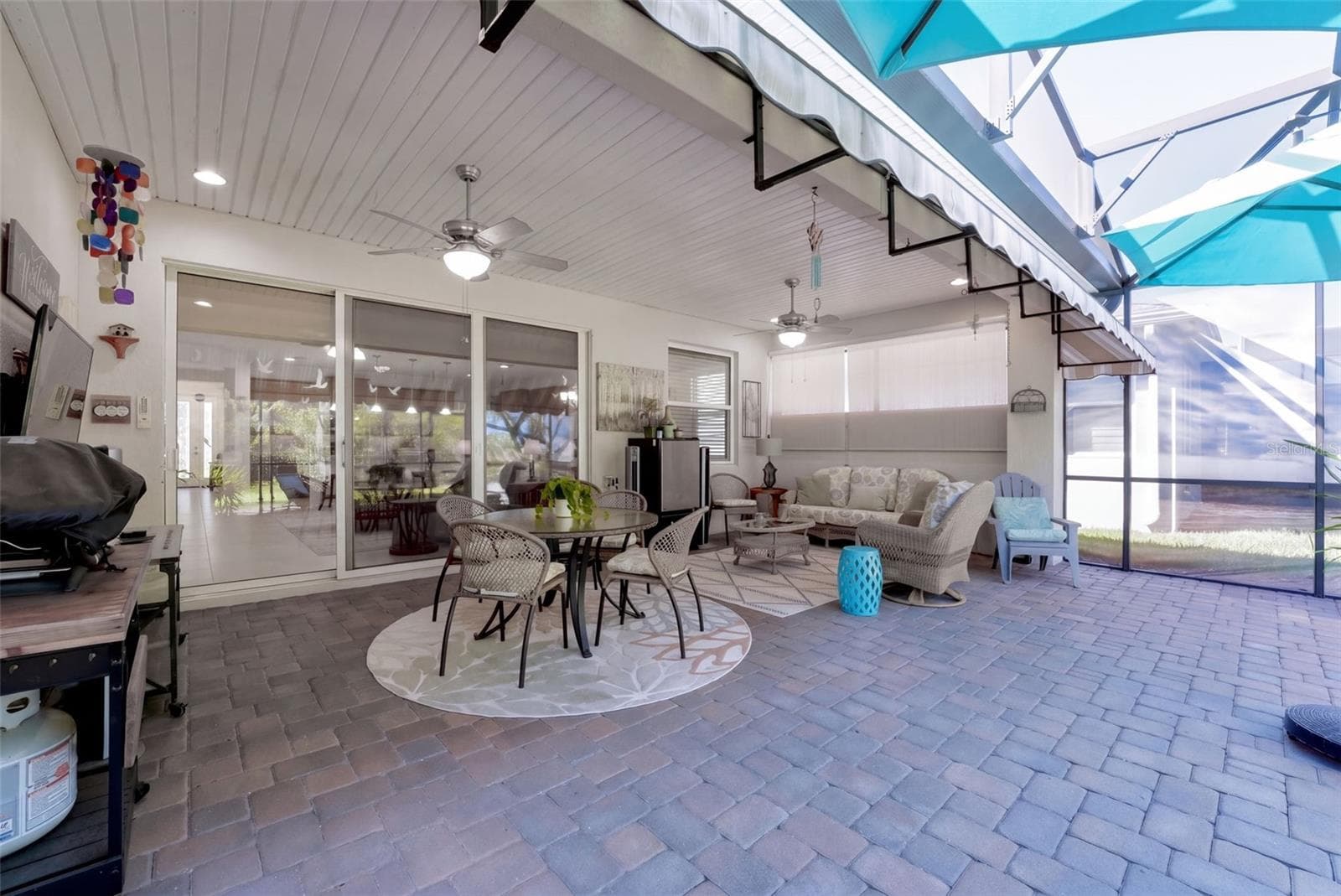 Screen enclosed covered Lanai w/ 2 ceiling fans, recessed lighting & a wall mounted flat screen TV - 1233 EGGLESTON DRIVE, DELAND