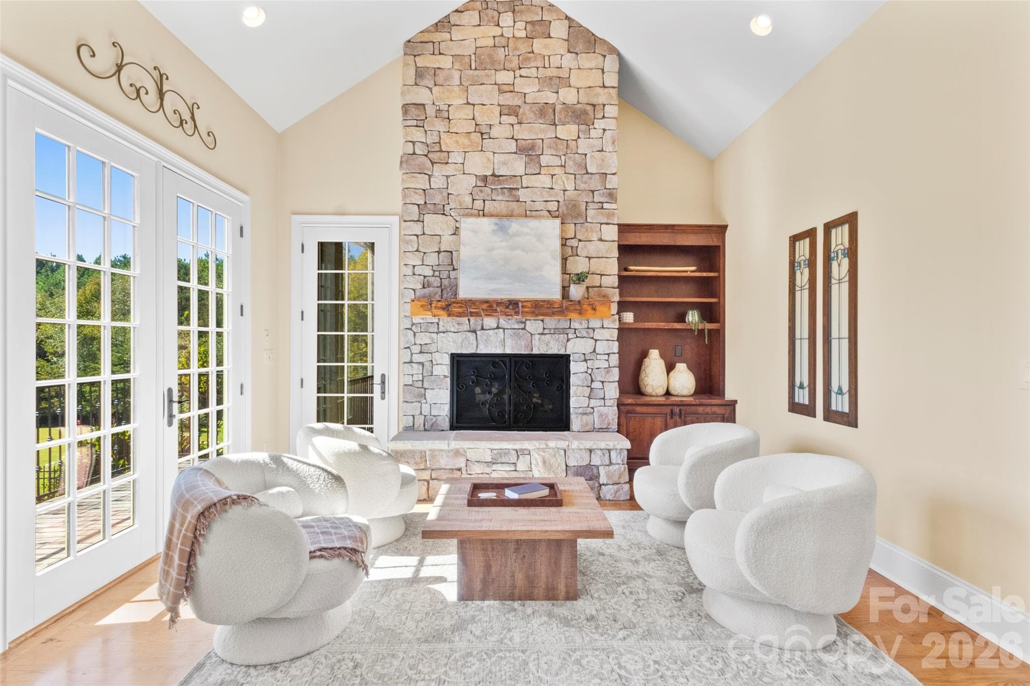 Special hearth room right off the kitchen with access to the screened porch, balconies, and staircase down to the rose garden - 973 Pinnacle Drive, Iron Station