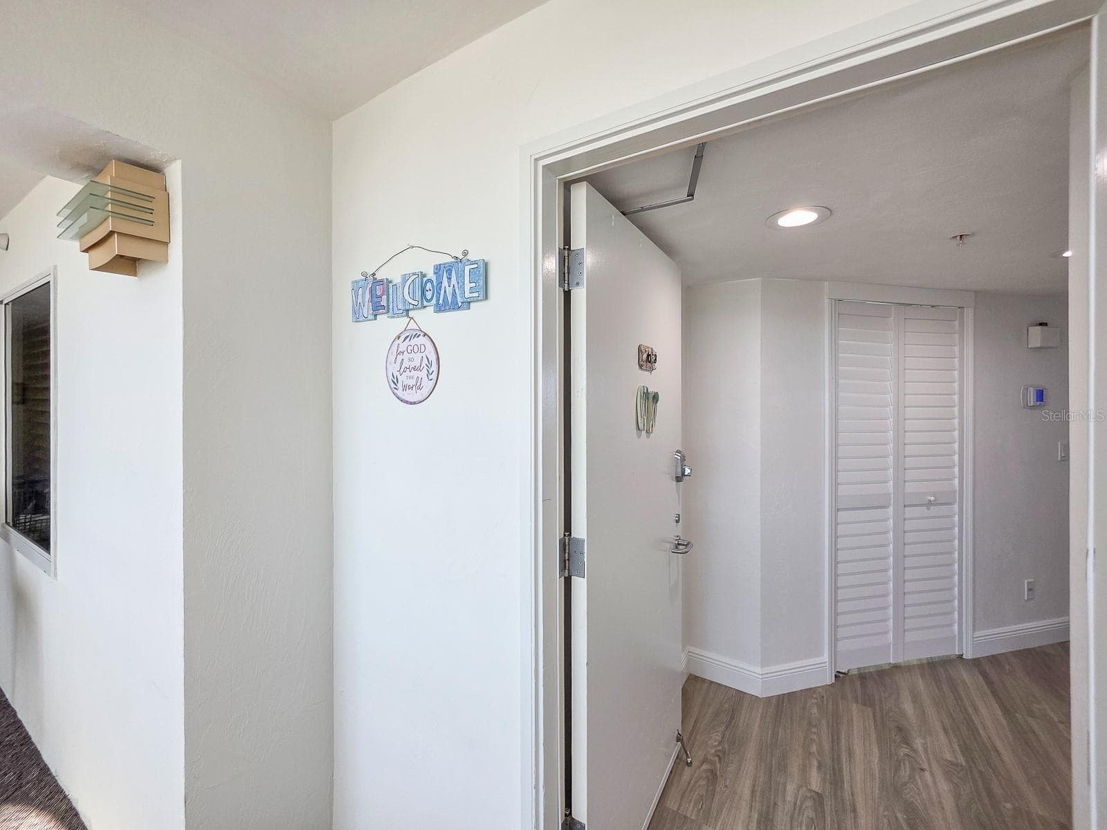 Welcome home. Foyer view of hallway closet as you're entering paradise. - 2545 S ATLANTIC AVE #403, DAYTONA BEACH SHORES