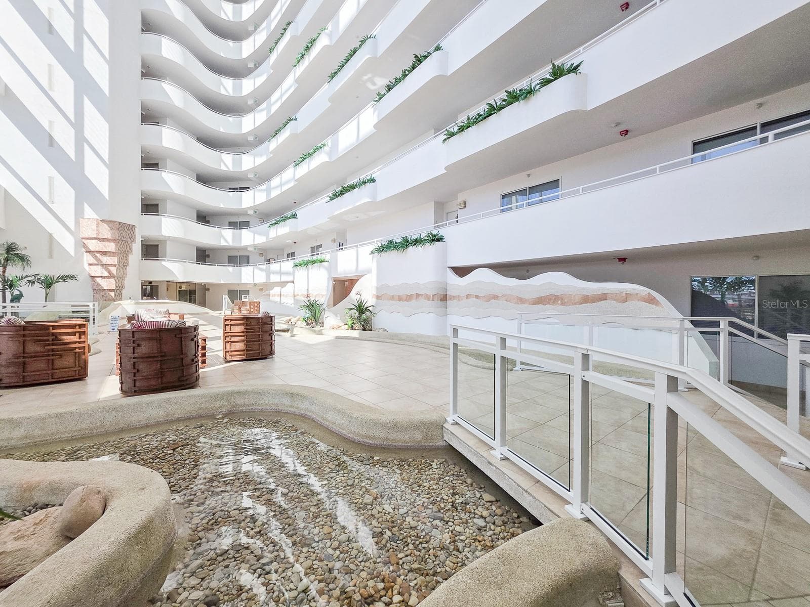 Lobby with waterfalls, streams and little bridges flowing throughout. - 2545 S ATLANTIC AVE #403, DAYTONA BEACH SHORES