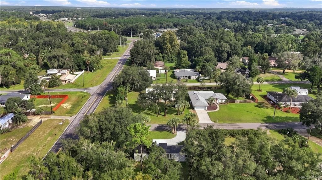 Aerial Neighborhood View – Elevated view highlighting the home's corner setting, surrounding residential neighborhood, mature trees & nearby roadways. - 6230 W GLEN ROBBIN CT, CRYSTAL RIVER