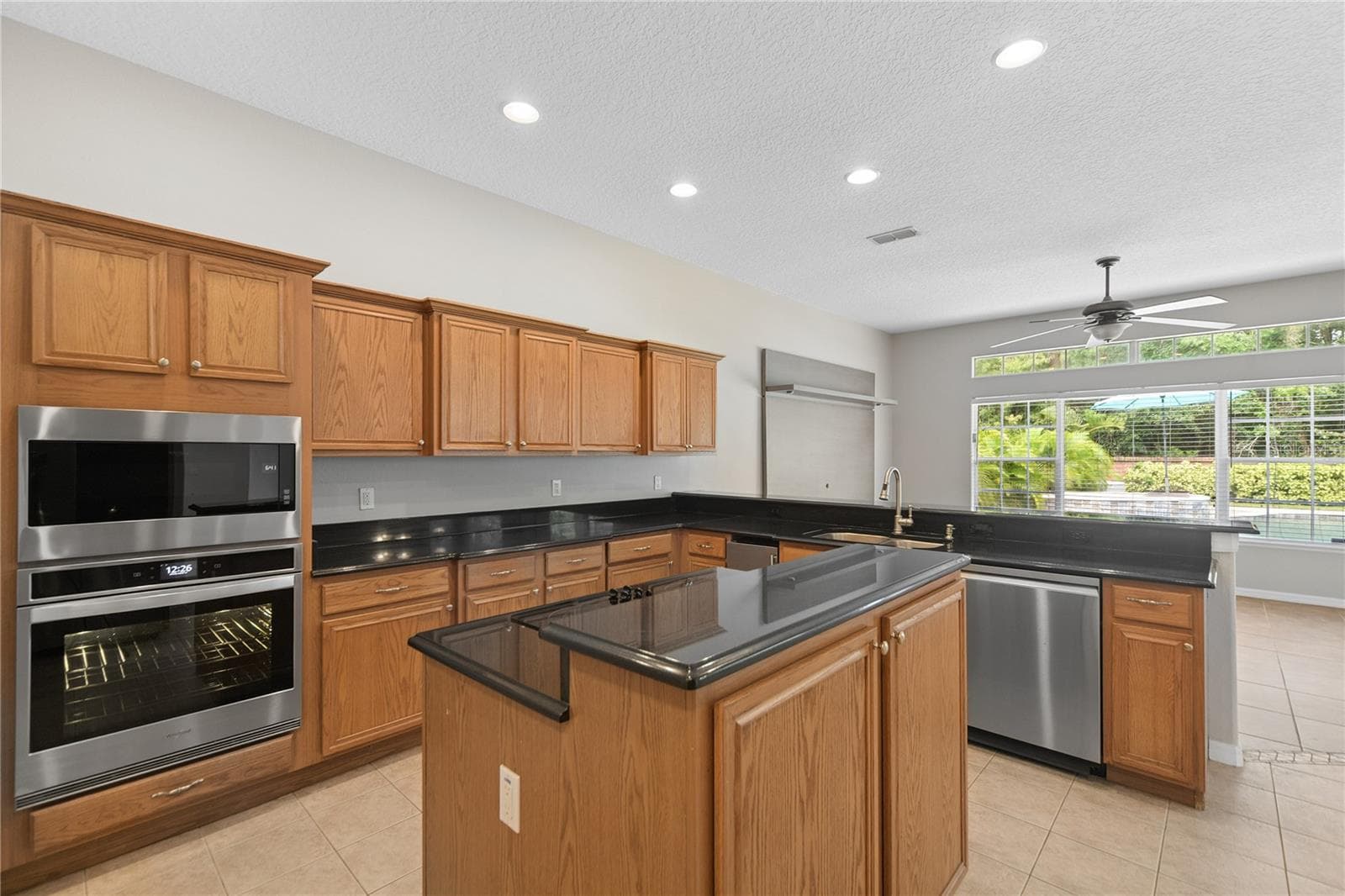 Here you can see the newer oven and microwave and the new dishwasher. - 16169 BRISTOL LAKE CIR, ORLANDO