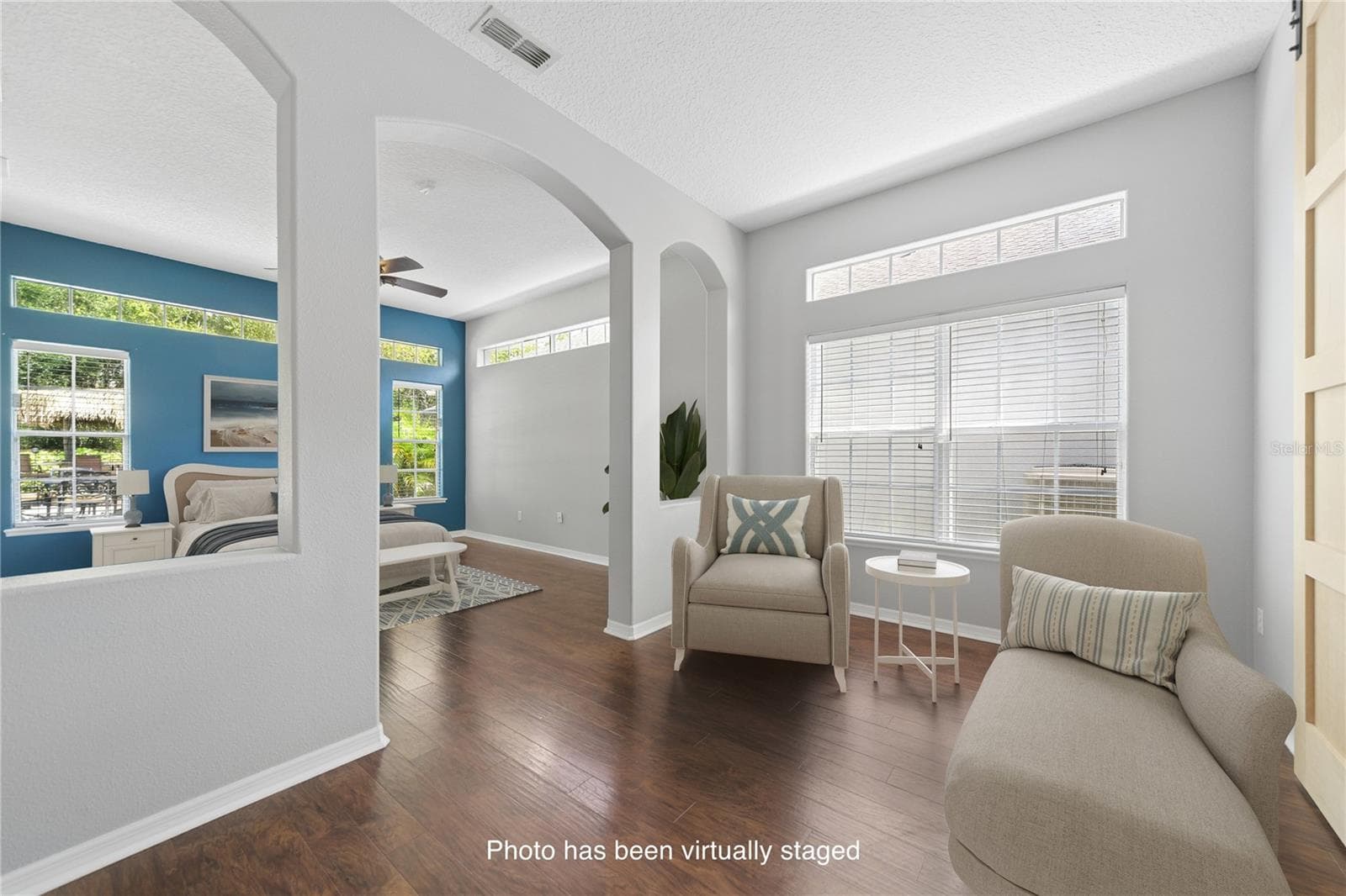 On to the private primary suite and when you first walk in you'll find a sitting room so you can peacefully enjoy the quiet (photo vitually staged). - 16169 BRISTOL LAKE CIR, ORLANDO