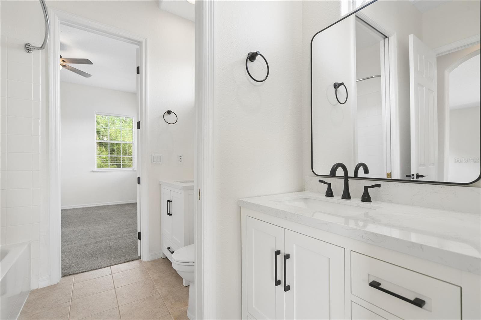 Bathroom 4 is a shared ensuite between bedrooms 3 & 4, each side has their own vanity area, and the bath/shower and toilet are shared. - 16169 BRISTOL LAKE CIR, ORLANDO