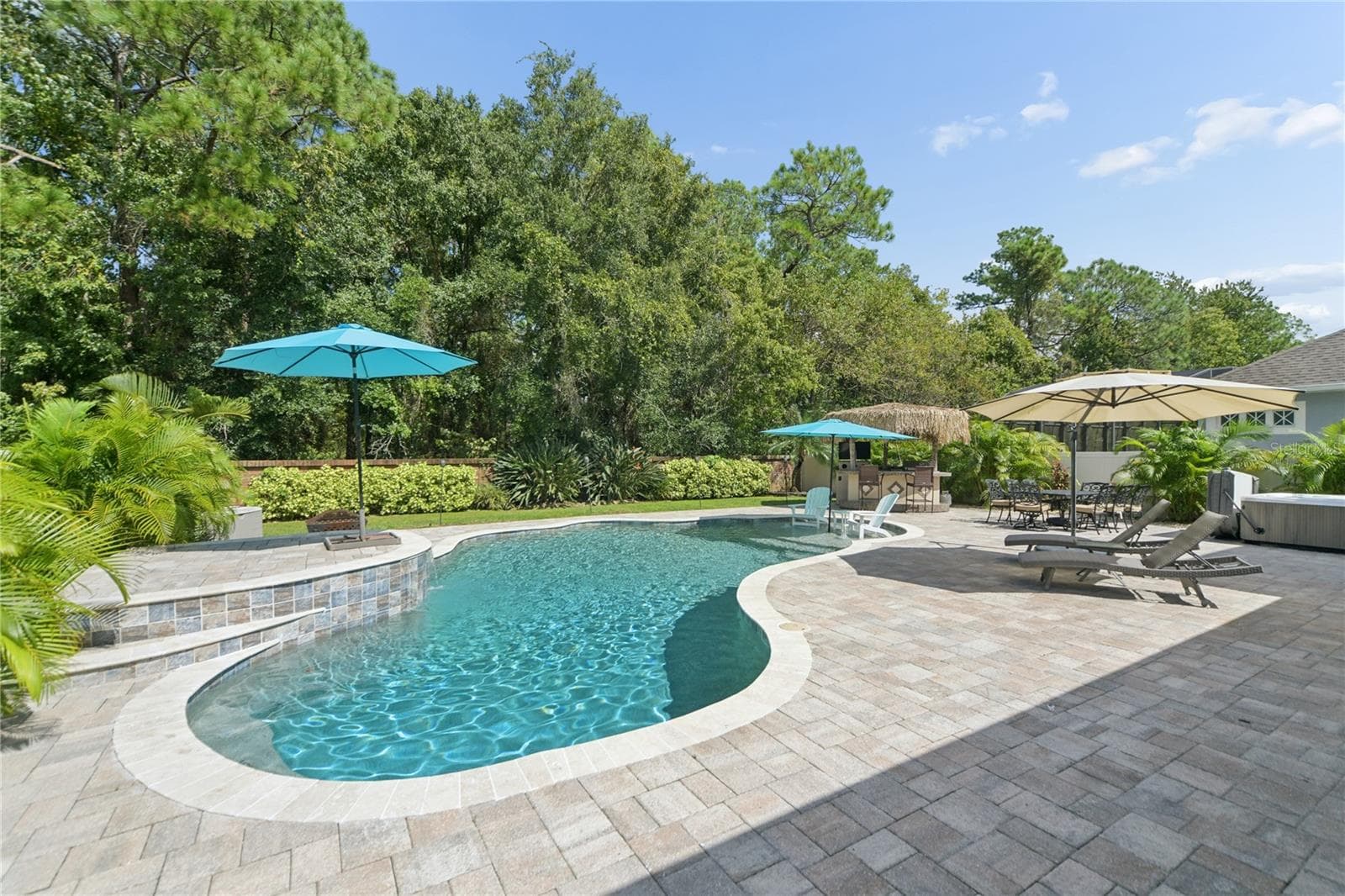 This is the deep end of the pool going down 6 ft but has a bench to sit on so you can rest and enjoy the sun. - 16169 BRISTOL LAKE CIR, ORLANDO