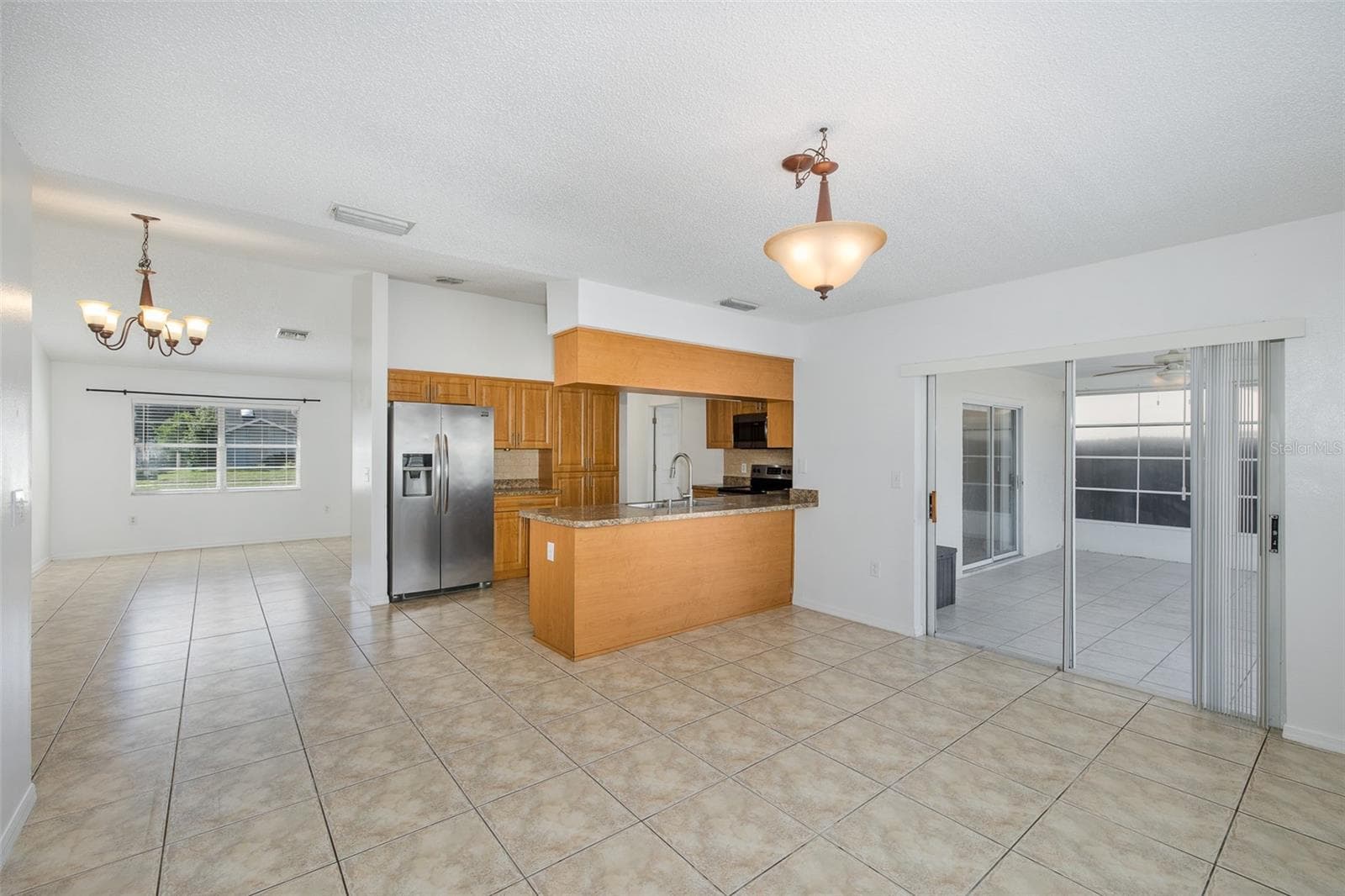 Family room overlooking the kitchen and dining - 8231 MATTHEW DR, NEW PORT RICHEY