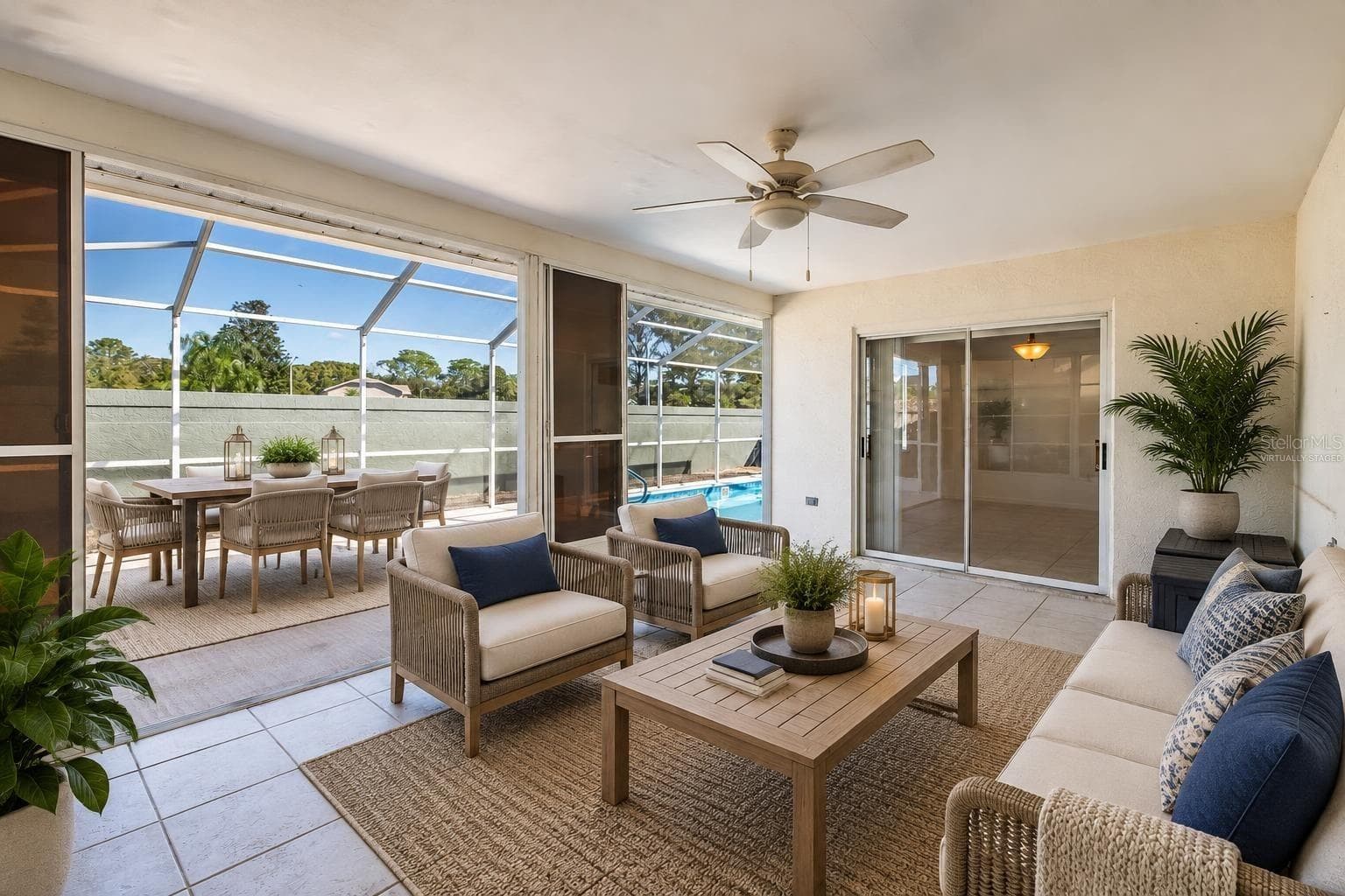 Virtually Staged Covered lanai leading out to pool - 8231 MATTHEW DR, NEW PORT RICHEY
