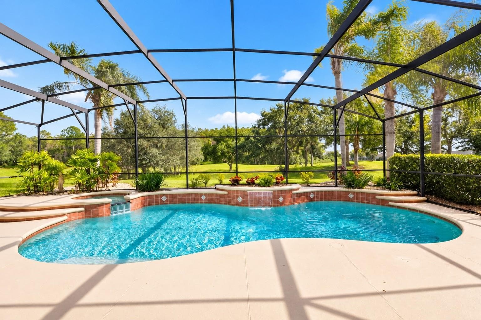 YOUR OWN PRIVATE TROPICAL PARADISE! STUNNING SCREEN-ENCLOSED, CUSTOM-DESIGNED POOL WITH BEAUTIFUL WATERFALL FEATURES, RAISED SPA, AND LUSH TROPICAL LANDSCAPING! Enjoy breathtaking views of the expansive green space with NO REAR NEIGHBORS, offering a peaceful and picturesque setting perfect for relaxing, entertaining, and enjoying the Florida lifestyle year-round! - 14542 RIVIERA POINTE DR, ORLANDO