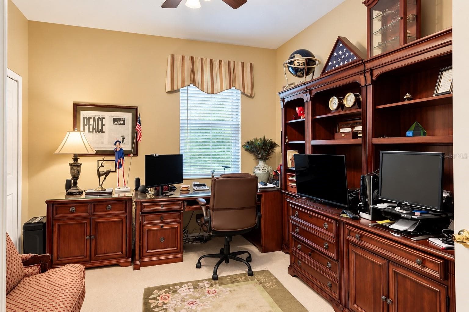 SPACIOUS AND VERSATILE DOWNSTAIRS BEDROOM CURRENTLY BEING USED AS A HOME OFFICE! Featuring abundant natural light, a ceiling fan, and plenty of room for a comfortable workspace. The BUILT-IN CLOSET HAS BEEN CUSTOMIZED INTO A WINE CLOSET, adding a unique touch to this flexible space. Whether used as a HOME OFFICE, GUEST BEDROOM, OR PRIVATE RETREAT, this room offers endless possibilities to suit your lifestyle! - 14542 RIVIERA POINTE DR, ORLANDO