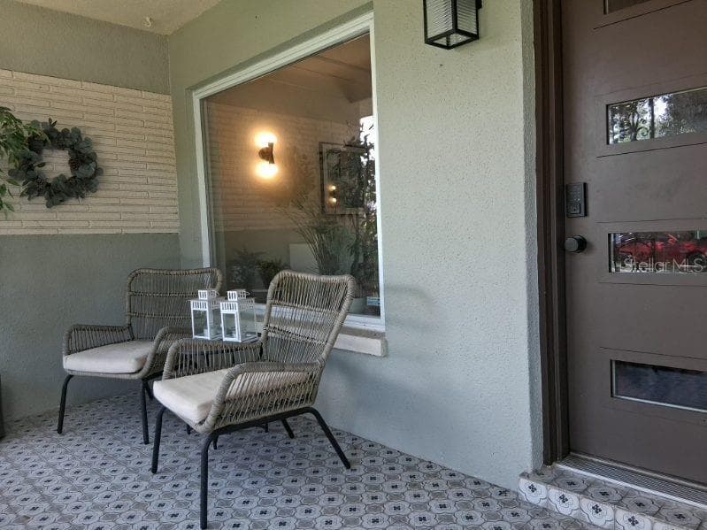 Welcome Home--the front porch is a great spot to catch sunrises and sunsets - 8220 YARDLEY AVE N, ST PETERSBURG