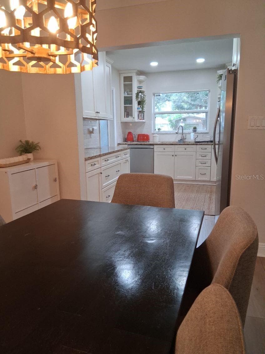 View from Dining Room into the Kitchen - 8220 YARDLEY AVE N, ST PETERSBURG