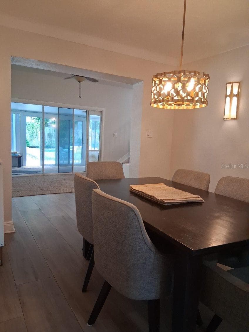 View from Dining Room to sliders out to the Sunroom - 8220 YARDLEY AVE N, ST PETERSBURG