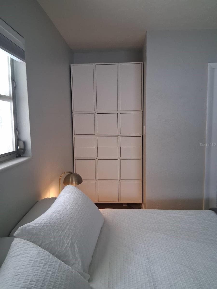 Built-in Storage in Primary Bedroom - 8220 YARDLEY AVE N, ST PETERSBURG