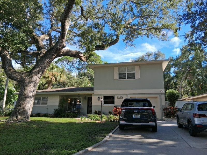One-car garage, with a long double driveway - 8220 YARDLEY AVE N, ST PETERSBURG