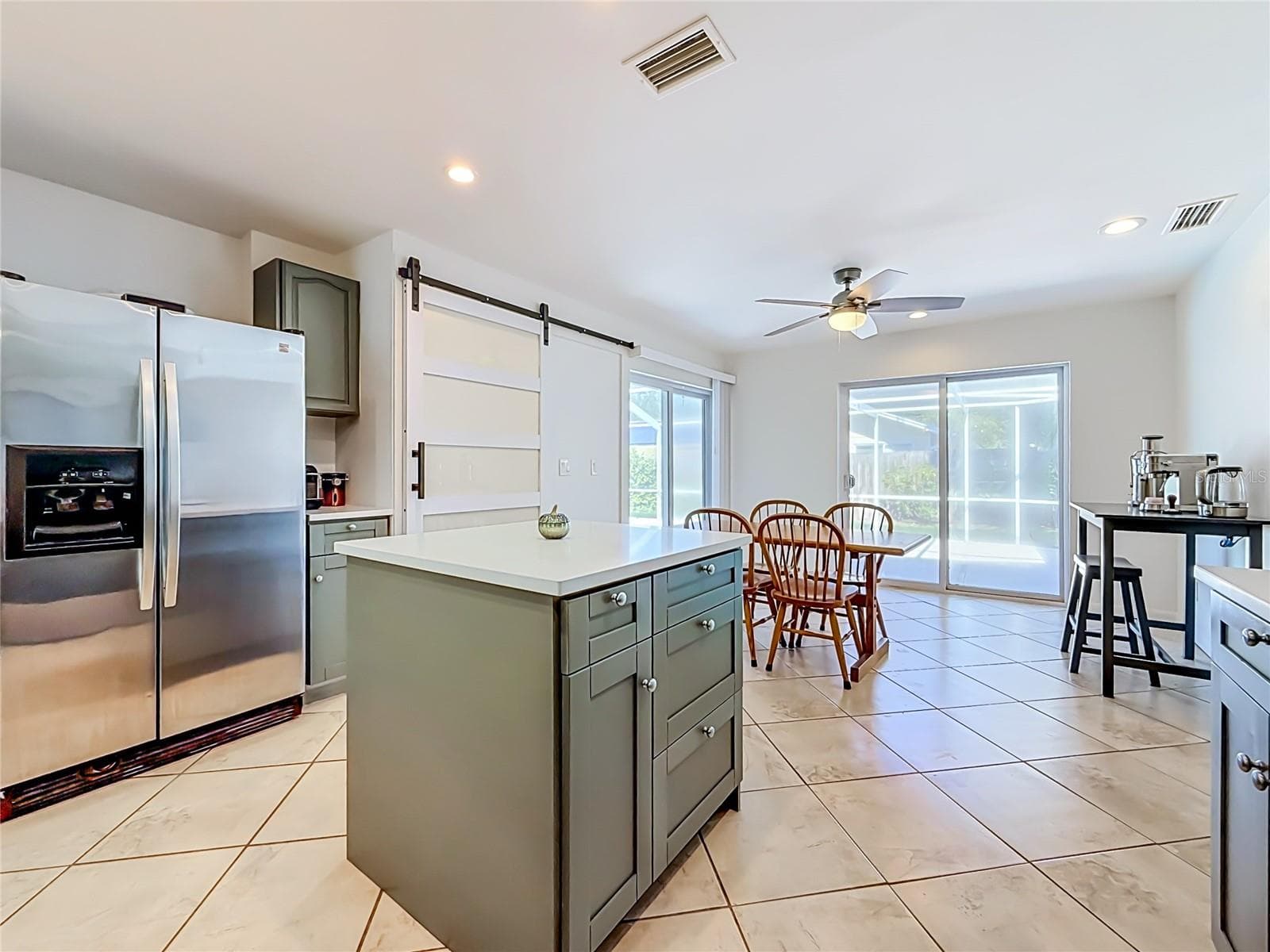 Kitchen - Dining Room - Outdoor Living and Pool Area - 1852 SOURWOOD BLVD, DUNEDIN