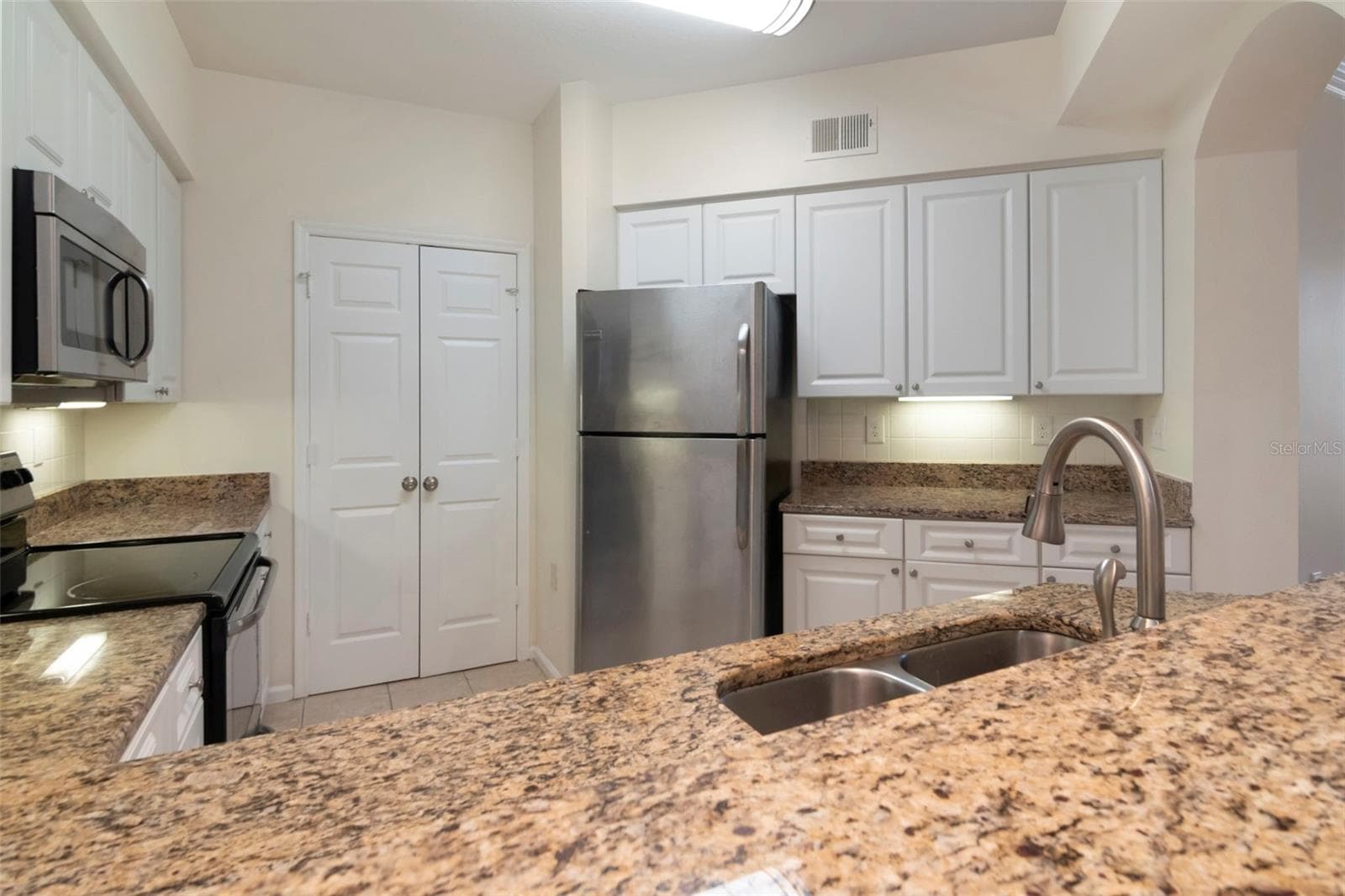 View into Kitchen From Bar - 4309 BAY CLUB CIR #4309, TAMPA