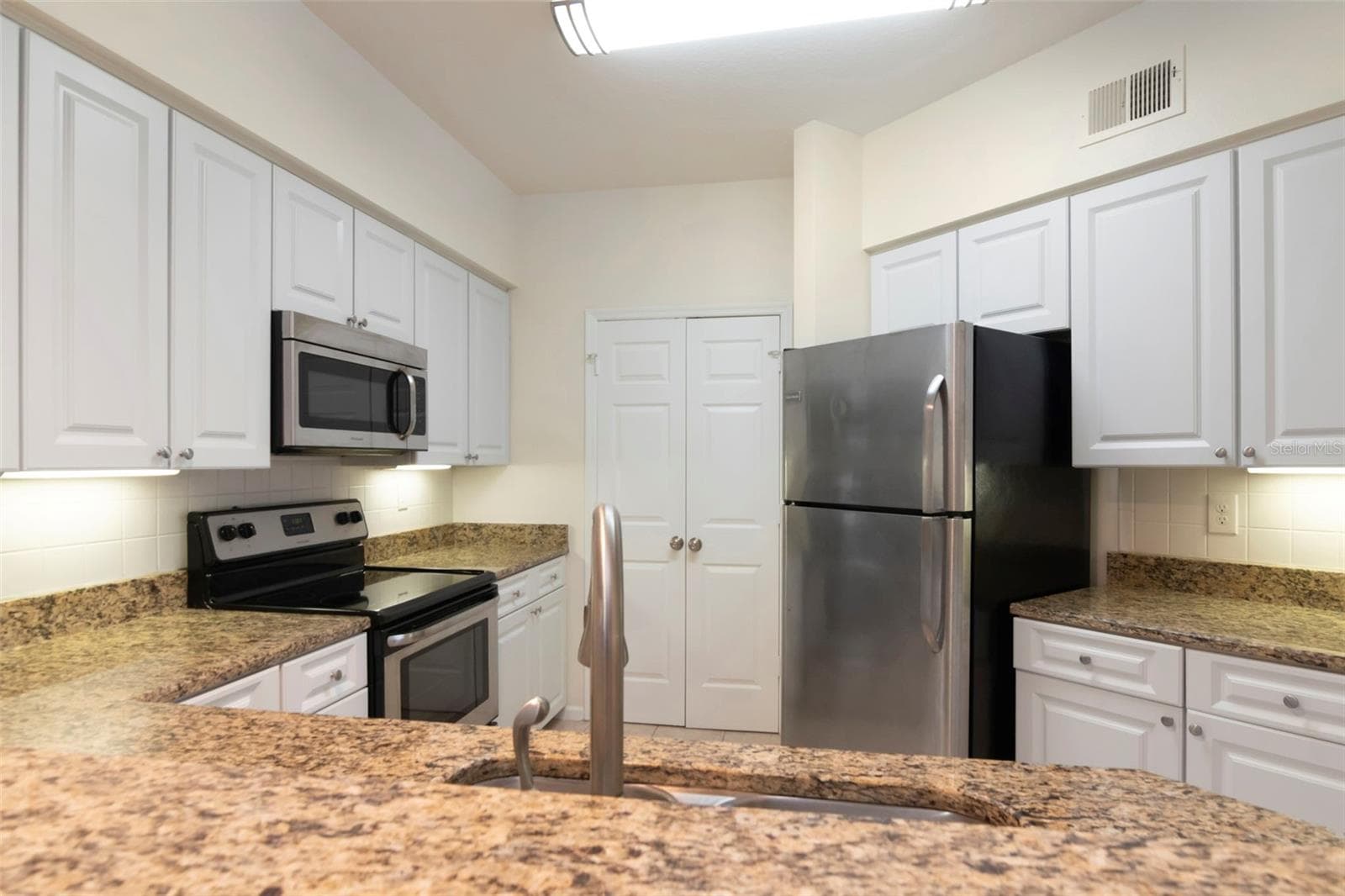 View into Kitchen From Bar - 4309 BAY CLUB CIR #4309, TAMPA