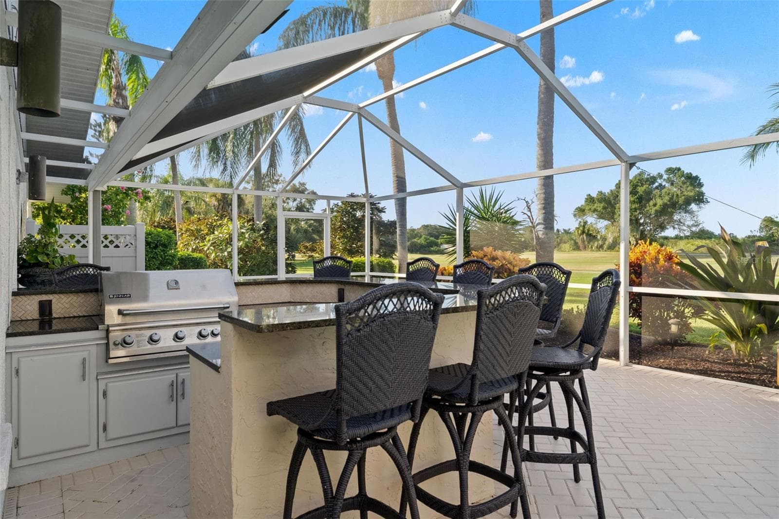 Outdoor bar with granite countertop - 966 N DORAL LN, VENICE