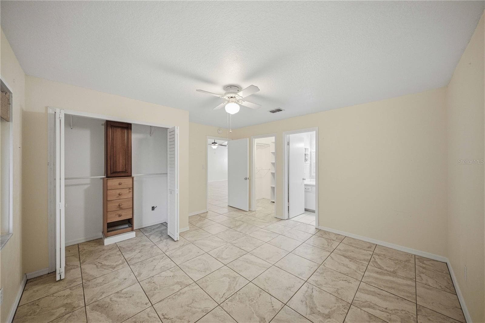 2nd closet with organizer in primary bedroom - 5013 SE 108TH PL, BELLEVIEW