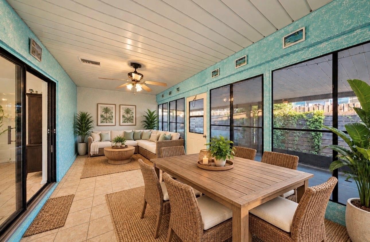 Large glass enclosed, heated and cooled lania. Virtually staged for decorating ideas - 5013 SE 108TH PL, BELLEVIEW