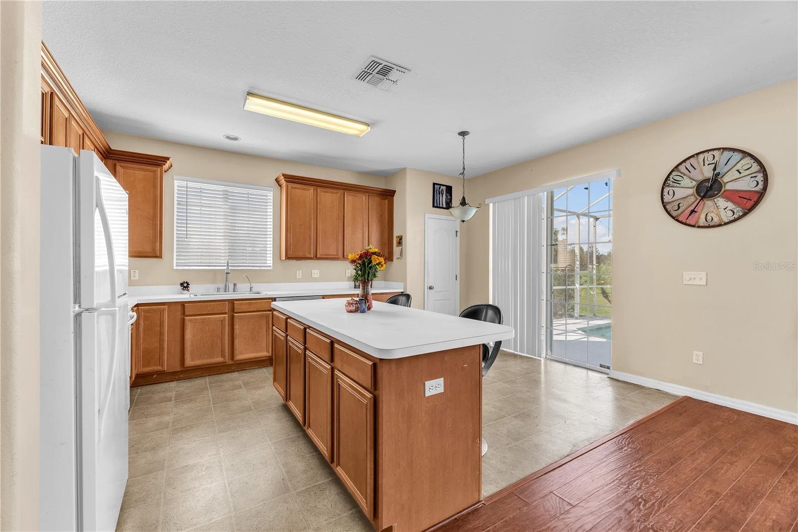 There is a closet pantry next to the sliding door for additional storage. - 18801 SUNTERRA DR, LAND O LAKES