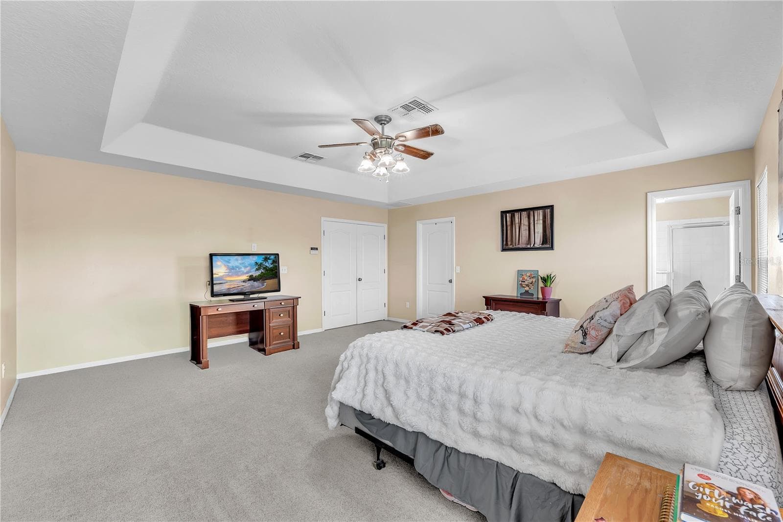 This is a true retreat featuring a walk-in closet so spacious it rivals the size of some bedrooms! - 18801 SUNTERRA DR, LAND O LAKES