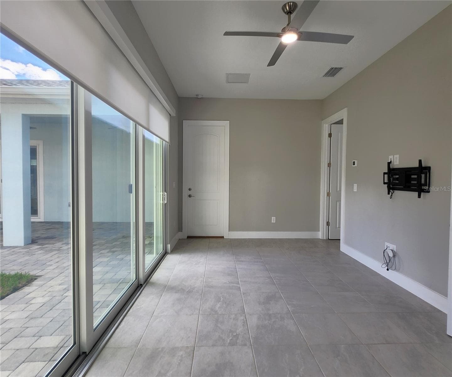 Guest House measures approximately 20x23, includes 1 bedroom, 1 full bathroom, living room, impact glass sliders with remote controlled shades. - 8896 DRUMMER PLANK DR, WESLEY CHAPEL