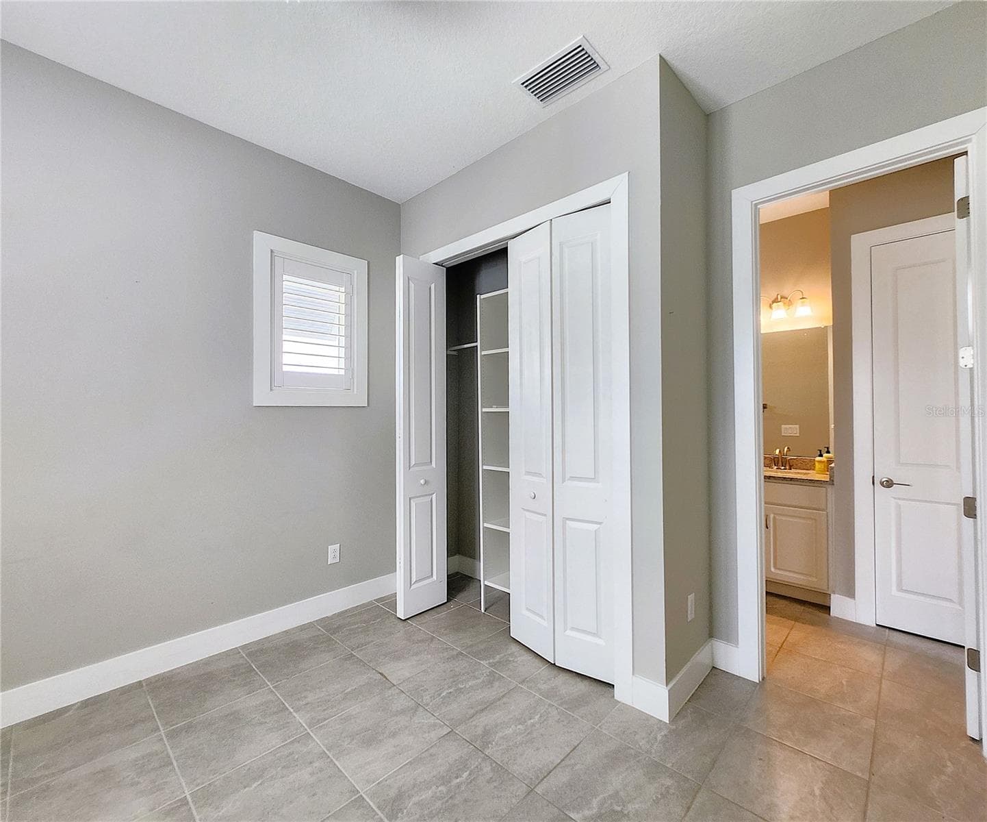Guest House measures approximately 20x23, includes 1 bedroom, 1 full bathroom, living room, impact glass sliders with remote controlled shades. - 8896 DRUMMER PLANK DR, WESLEY CHAPEL