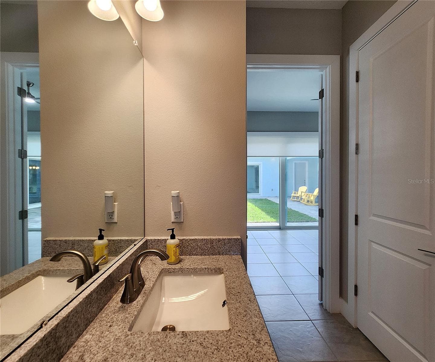 Guest House measures approximately 20x23, includes 1 bedroom, 1 full bathroom, living room, impact glass sliders with remote controlled shades. - 8896 DRUMMER PLANK DR, WESLEY CHAPEL