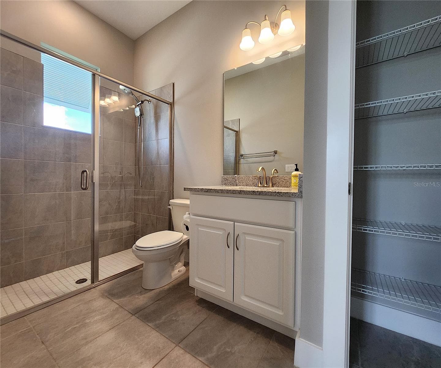 Guest House measures approximately 20x23, includes 1 bedroom, 1 full bathroom, living room, impact glass sliders with remote controlled shades. - 8896 DRUMMER PLANK DR, WESLEY CHAPEL